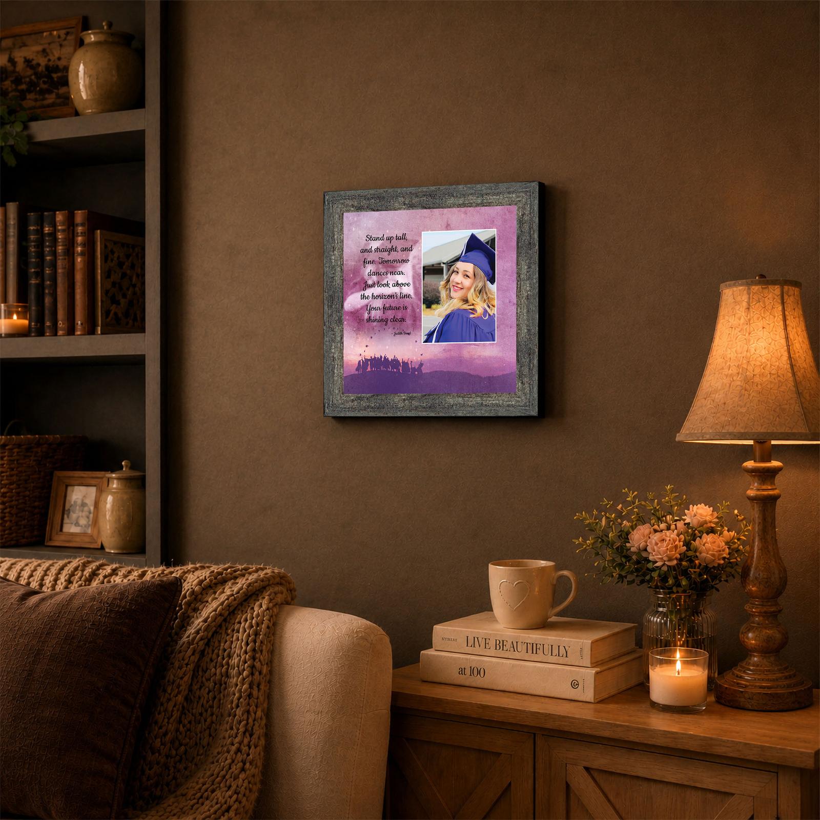 Stand Tall Graduate keepsake displayed on a dorm room desk