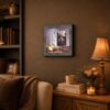 A Cat's Prayer framed wall art displayed on a home office shelf