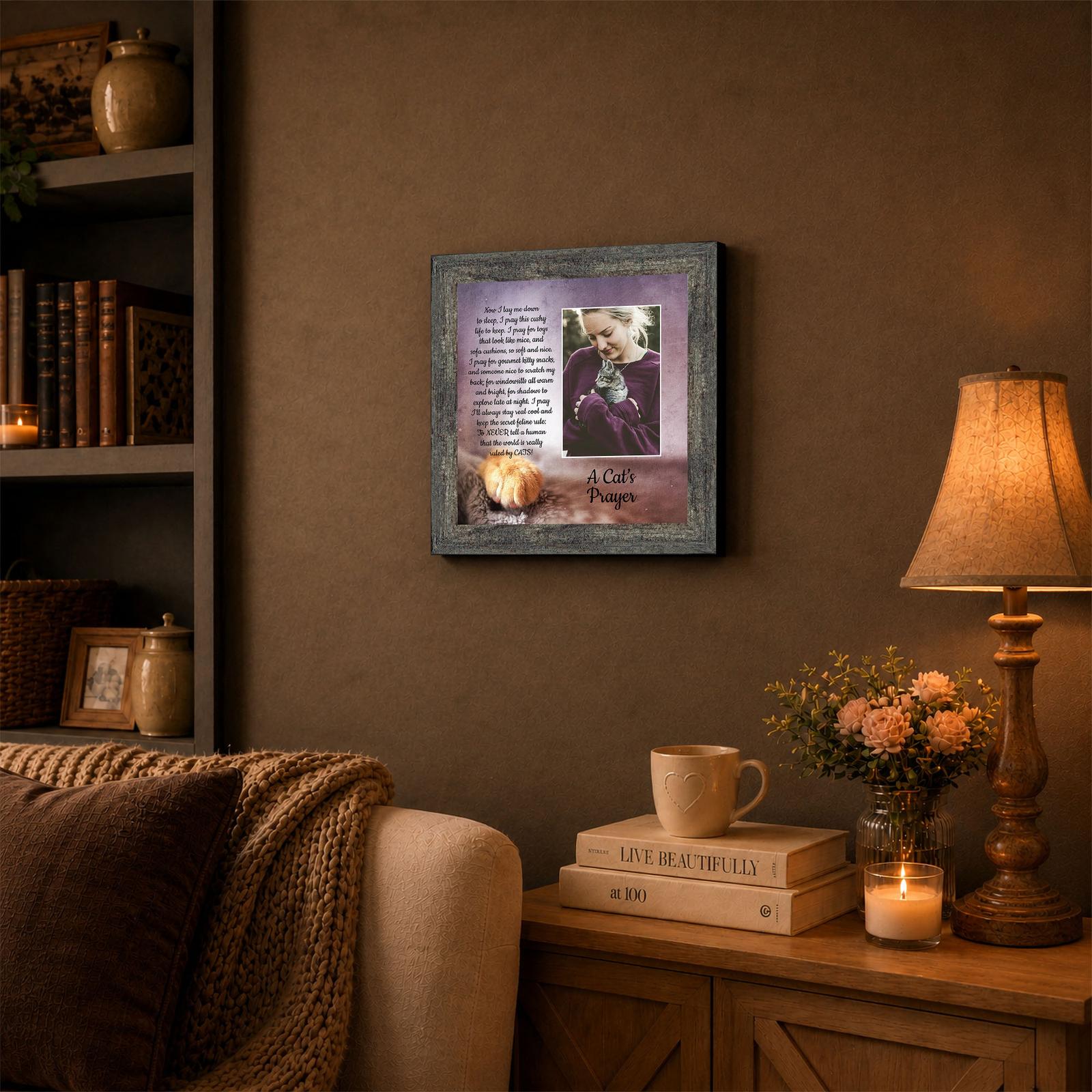A Cat's Prayer framed wall art displayed on a home office shelf