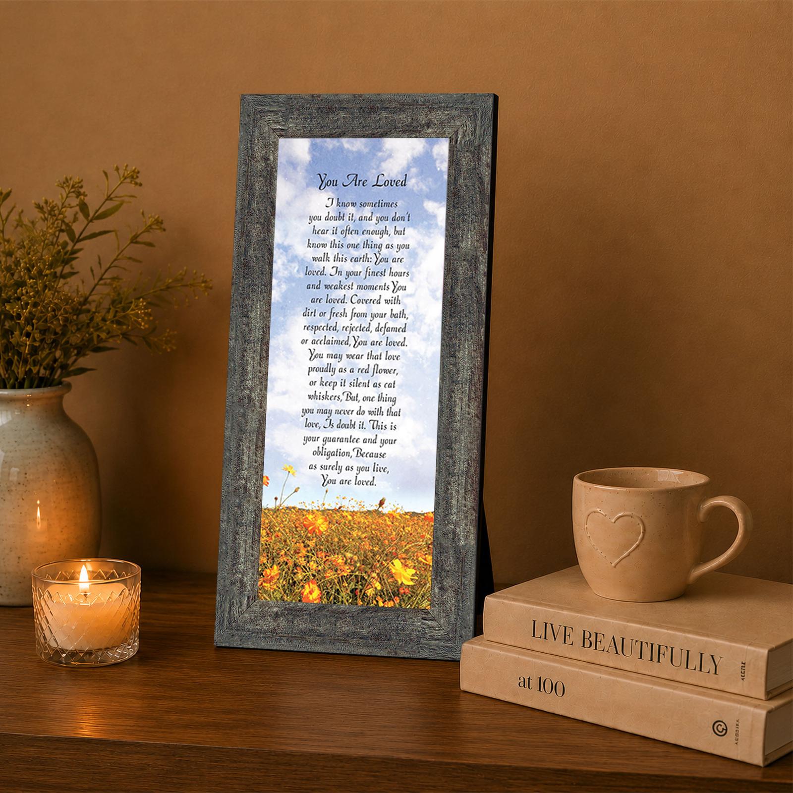 You Are Loved framed wall art displayed in a living room