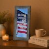 Joshua 1:9 American flag framed wall art displayed in a home office