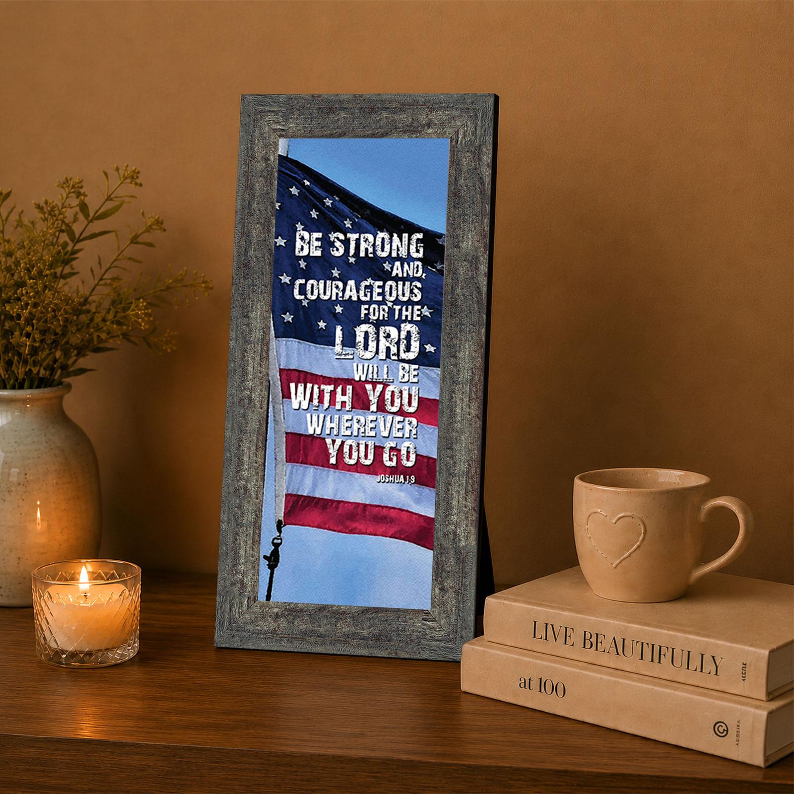 Joshua 1:9 American flag framed wall art displayed in a home office