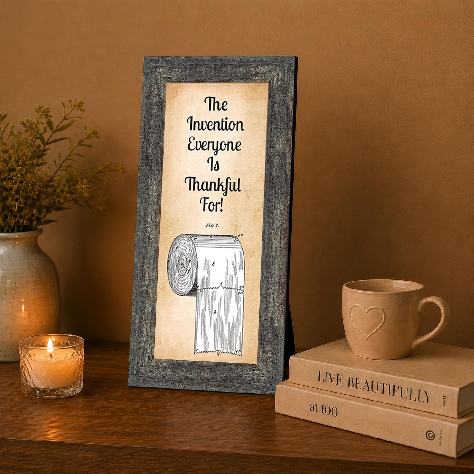 Toilet paper patent print framed wall art displayed in a guest bathroom