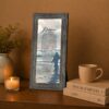 Footprints in the Sand framed wall art displayed in an entryway
