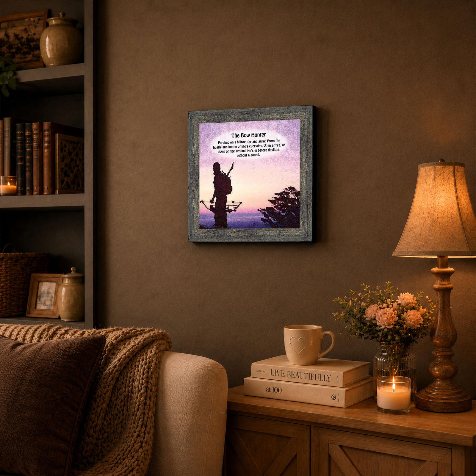 The Bow Hunter framed wall art displayed in a cabin or den