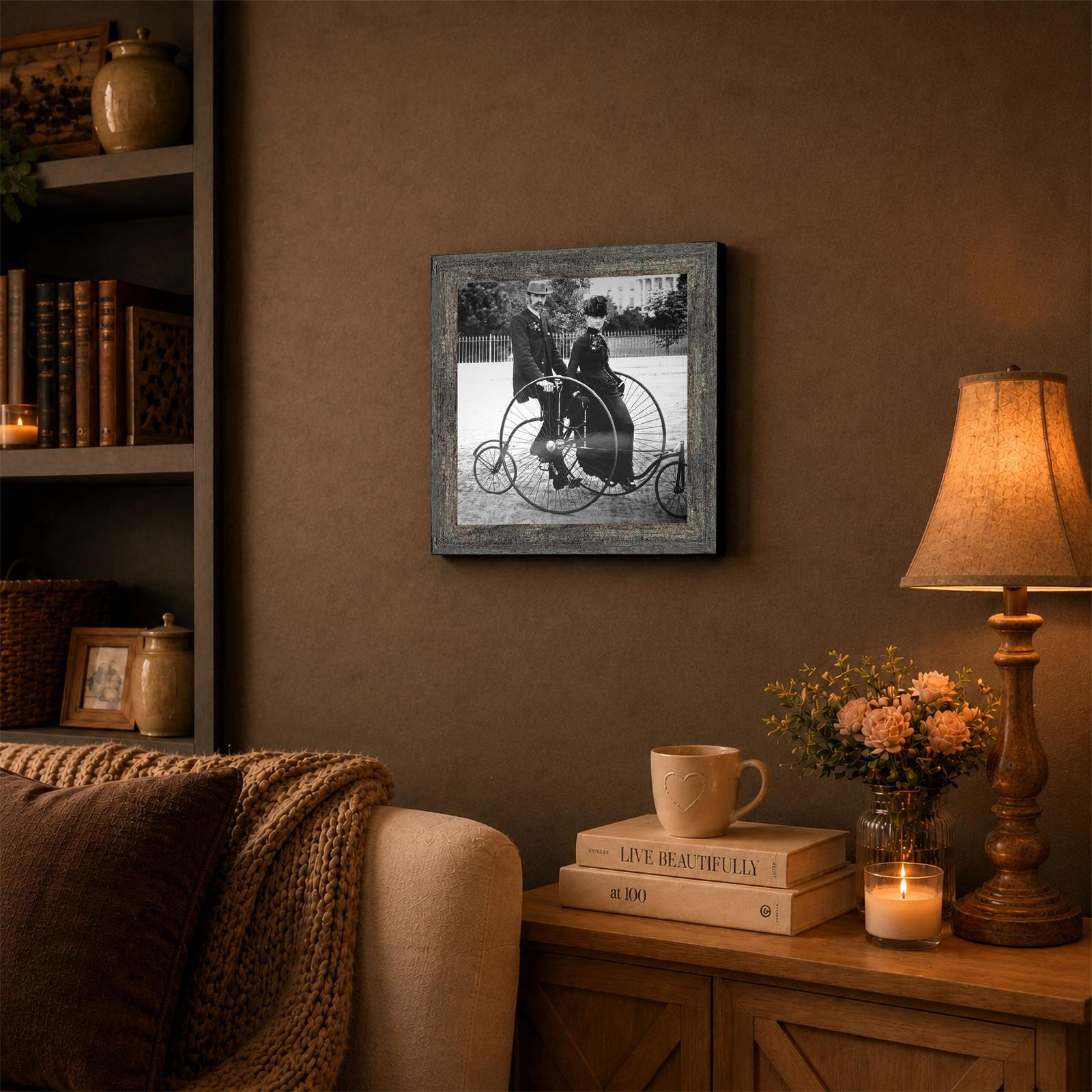 Framed black and white 1880s cycling photograph displayed in a study