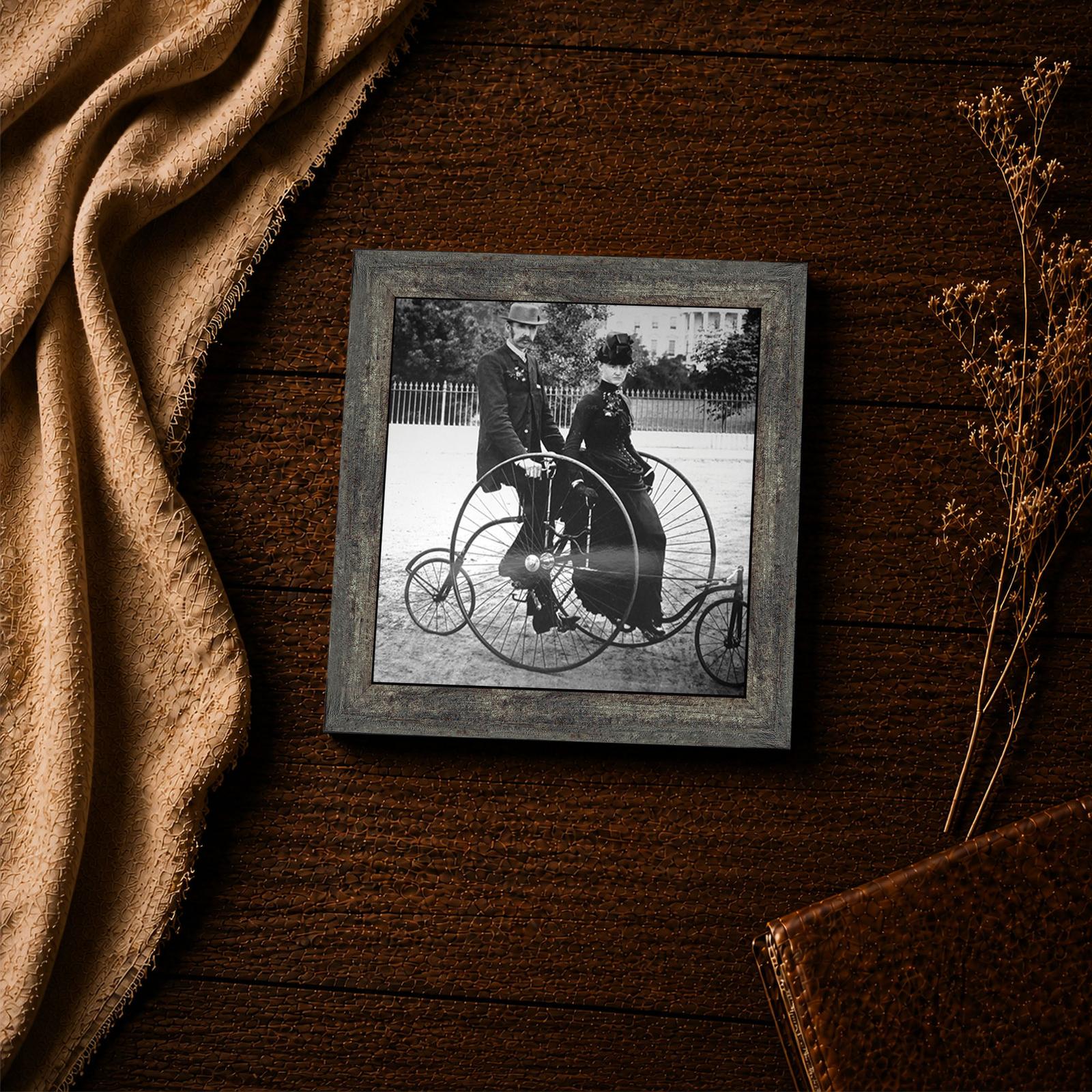 1880s couple on a two-seat tricycle - black and white Americana closeup