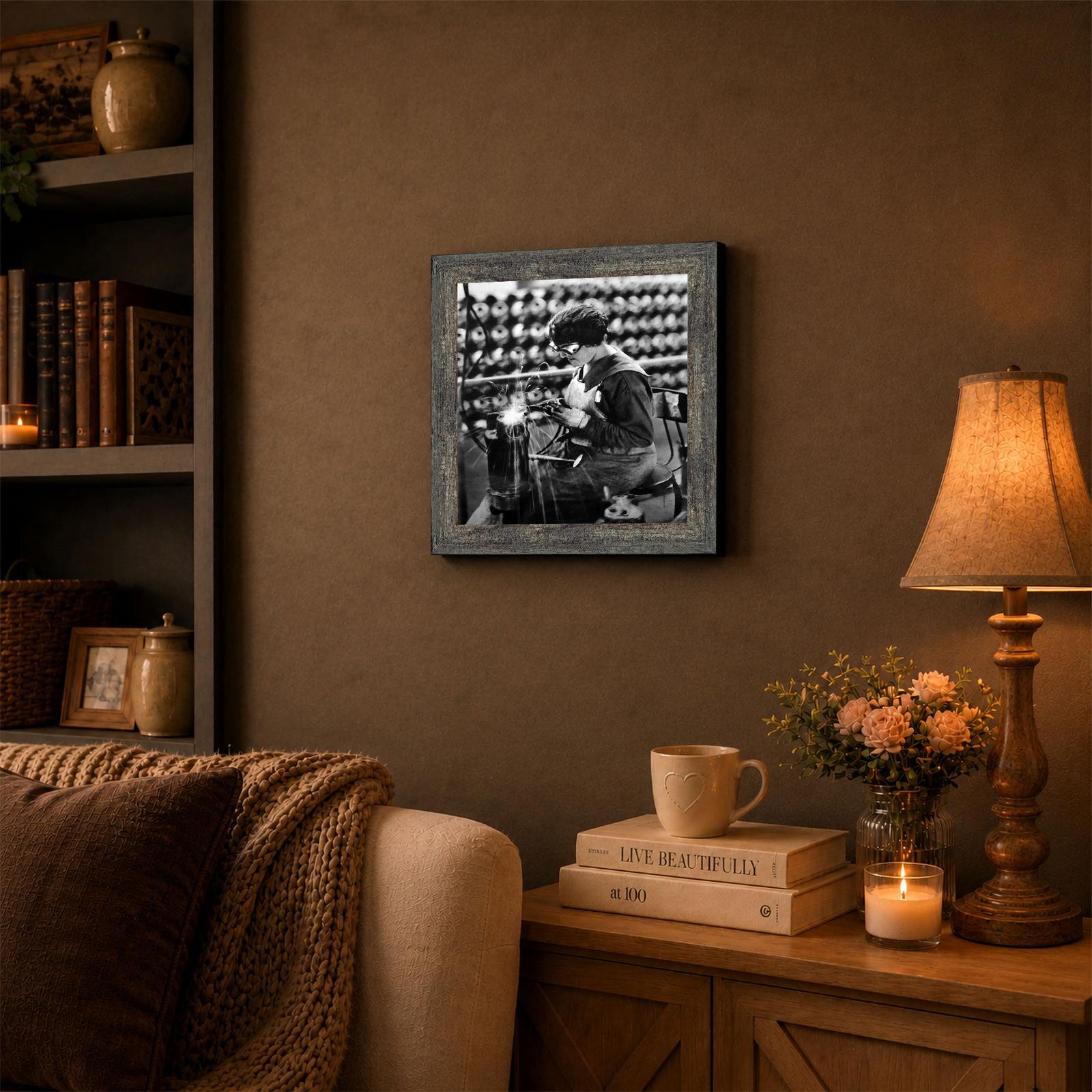 Woman welder framed wall art displayed in a den or office
