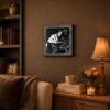 Man in factory framed wall art displayed in a man cave